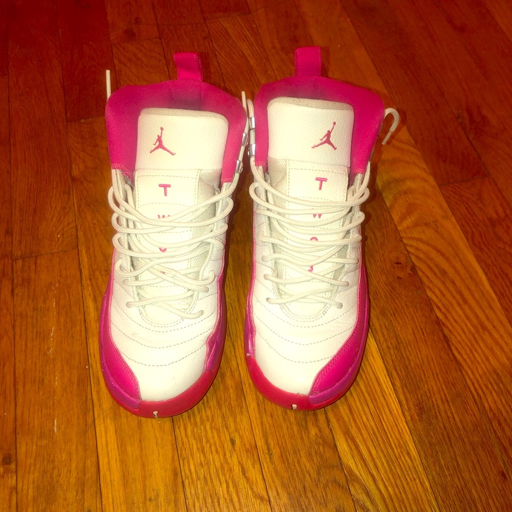 White and pink Jordan 12s